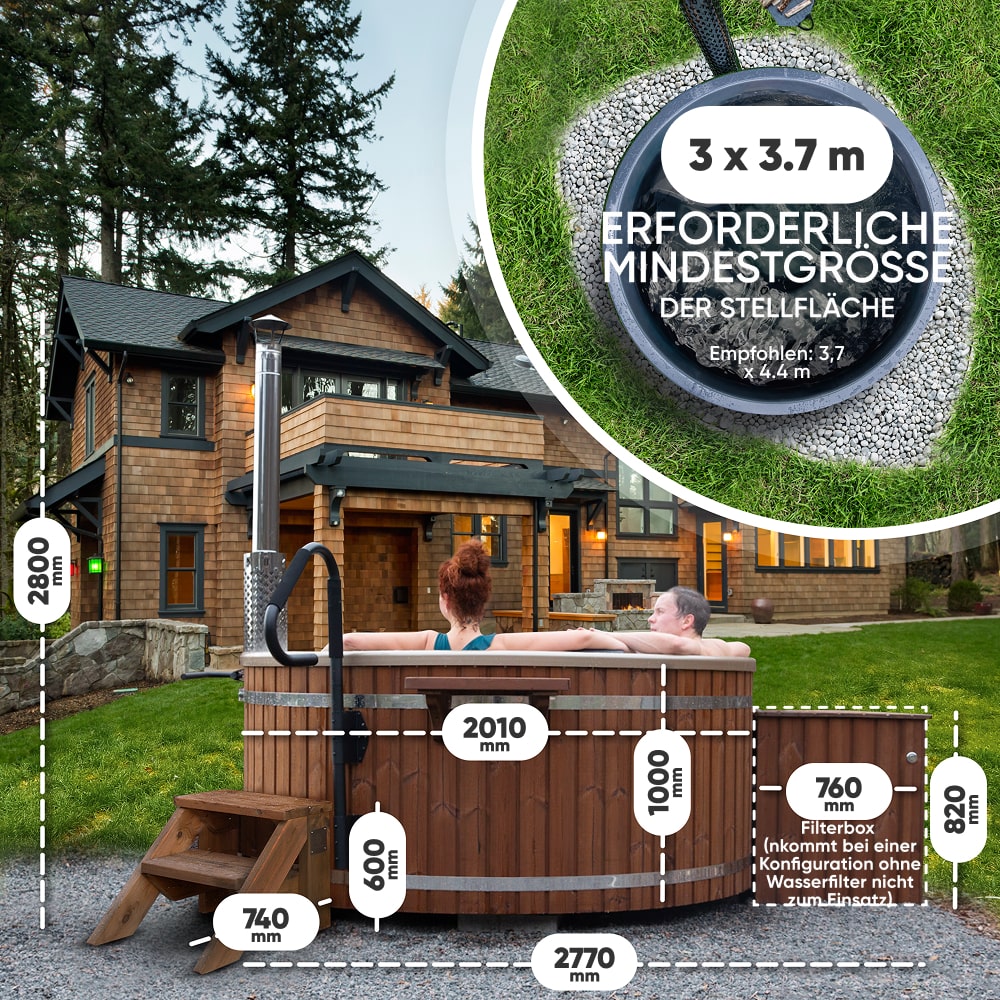 Outdoor view of a wooden hot tub with steps and measurements in front of a large house surrounded by trees in the evening