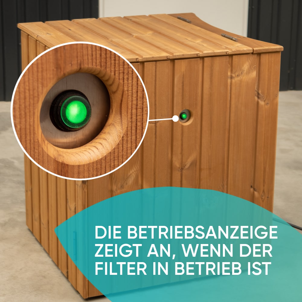 Outdoor view of wooden enclosure with green indicator light showing filter operation status