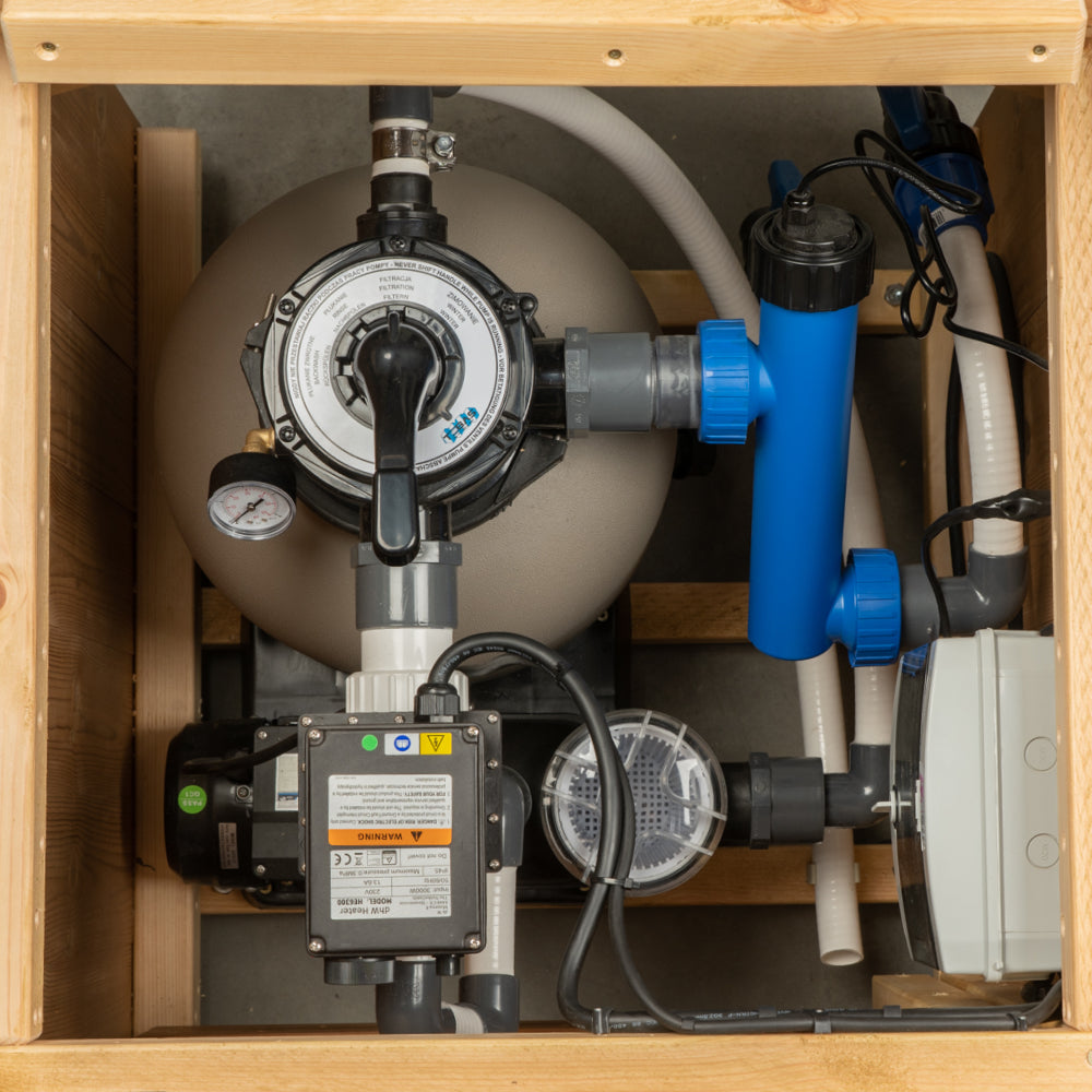 Close-up of pool filtration system inside a wooden enclosure.