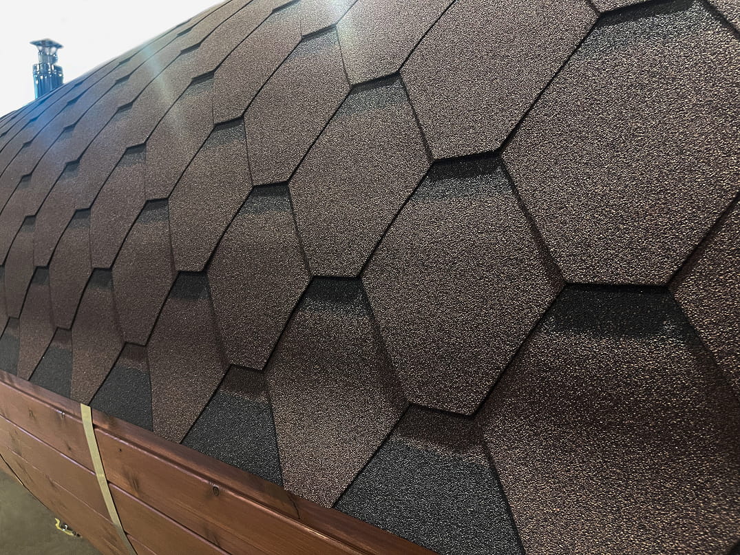 Hexagonal roof shingles on a sauna roof