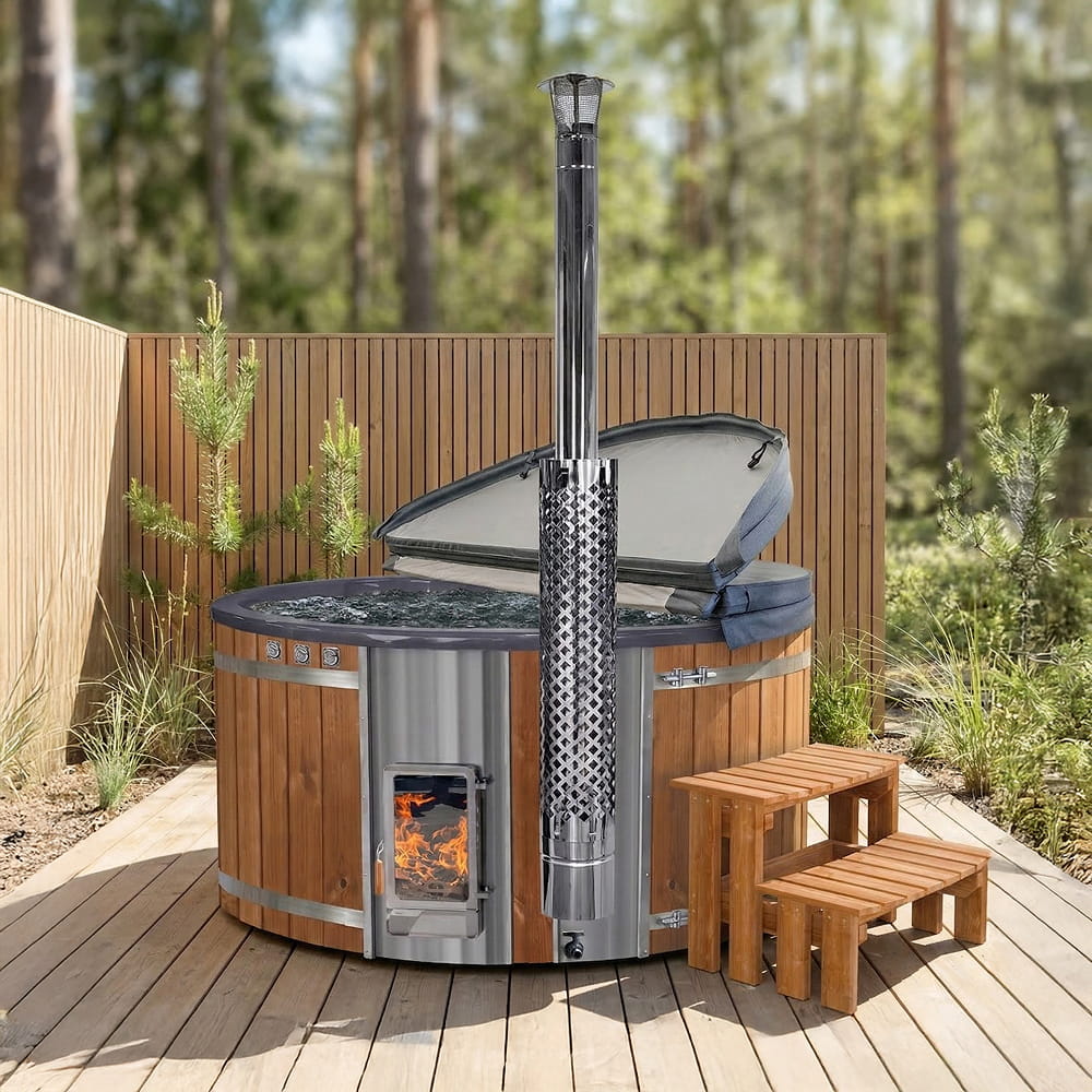 Outdoor hot tub with wood-fired stove Verta on a wooden deck with trees in the background